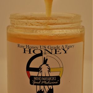 Raw honey jar with spoon